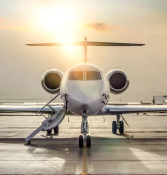 Front view of a private jet on the runway
