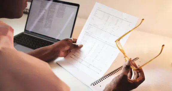 Hands, accountant and woman with document for finance, tax or audit