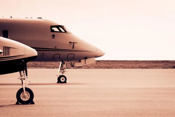 Private aircraft parked on an airport tarmac