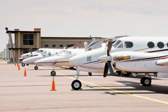Private aircraft parked at an aviation facility